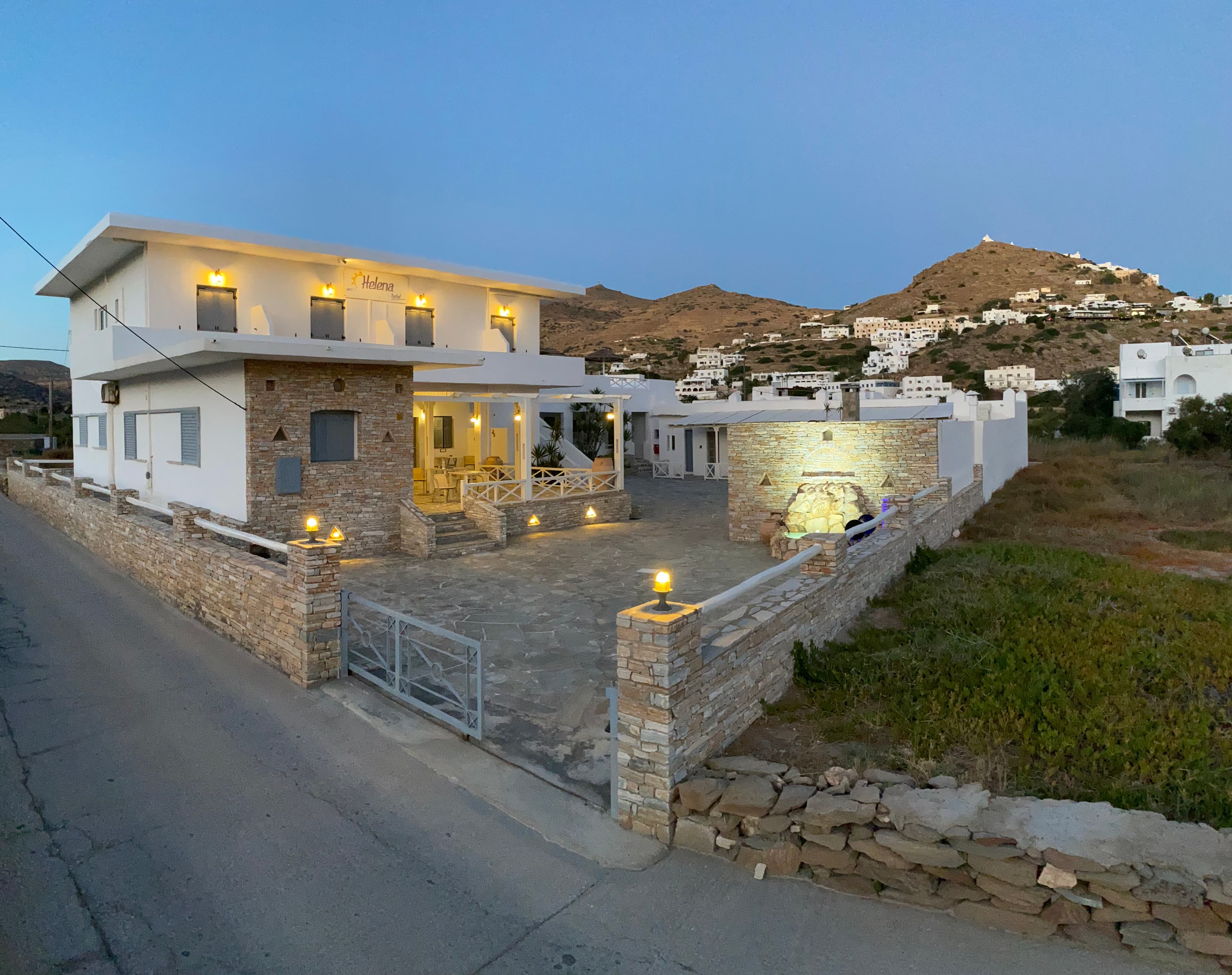 Helena Hotel exterior at dusk in Ios
